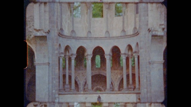 Video Reference: architecture, stone, arches, columns, historic, building, facade, ornamental, close-up, old film, outdoor, monument, ruins, symmetry