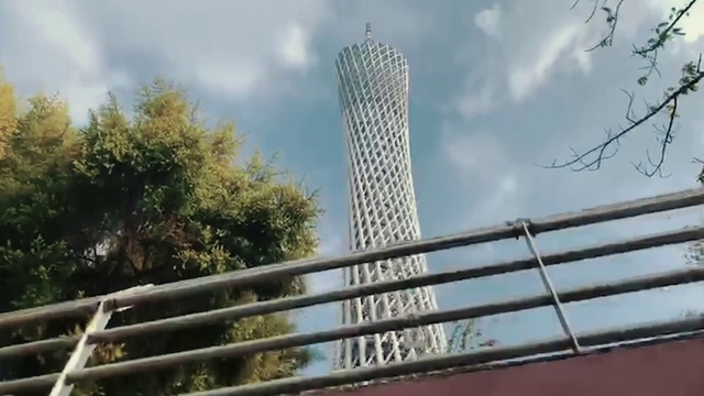 Video Reference: Sky, Cloud, Building, Skyscraper, Tower, Tree, Tower block, Fence, Condominium, Urban design