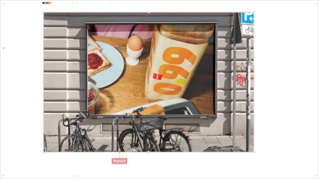 Video Reference: billboard, advertisement, street, city, bicycle, outdoor, poster, food, breakfast, toast, egg, urban, wall, sidewalk, public space, Munich