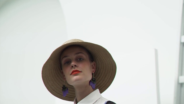 Video Reference: Outerwear, Hat, Sun hat, Sunglasses, Fashion design, Art, Costume hat, Vintage clothing, Street fashion, Eyewear