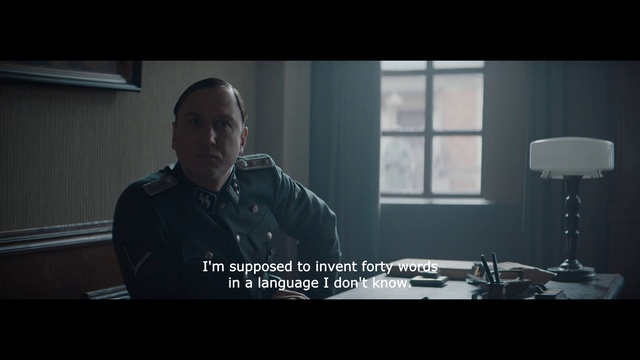 Video Reference: Flash photography, Font, Screenshot, Darkness, Audio equipment, Movie, Sitting, Photo caption, Glass, Room