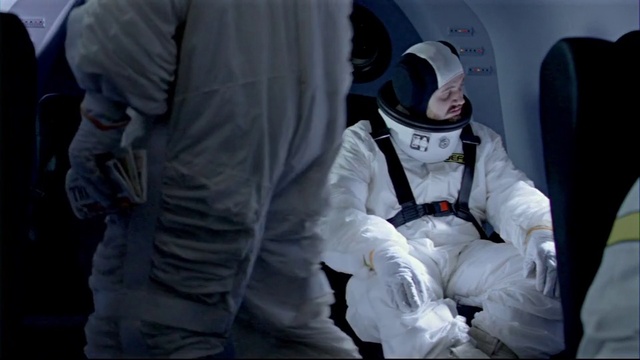 Video Reference: Helmet, Astronaut, Sleeve, Gesture, Workwear, Personal protective equipment, Aircraft, Service, Uniform, Recreation
