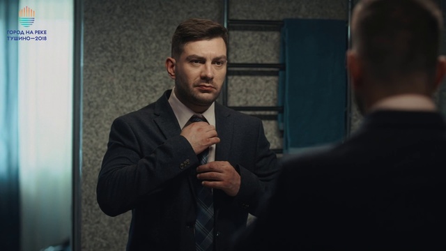 Video Reference: Forehead, Gesture, Collar, Dress shirt, Blazer, White-collar worker, Event, Formal wear, Suit, Flash photography