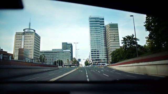 Video Reference: Building, Skyscraper, Sky, Daytime, Photograph, Light, Road surface, Tower block, Asphalt, Mode of transport