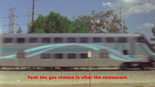 Video Reference: Sky, Cloud, Tree, Vehicle, Rolling stock, Railway, Font, Facade, Motor vehicle, Building