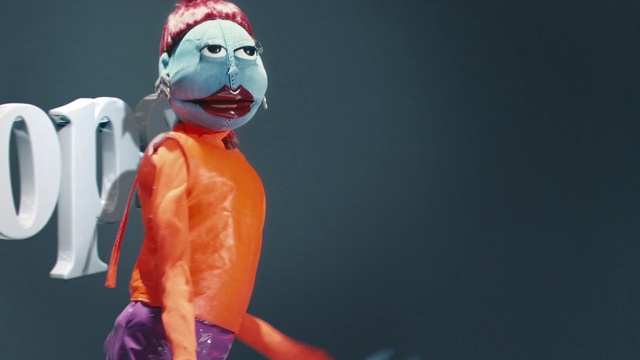 Video Reference: Gesture, Toy, Performing arts, Art, Entertainment, Event, Electric blue, Fun, Action figure, Personal protective equipment