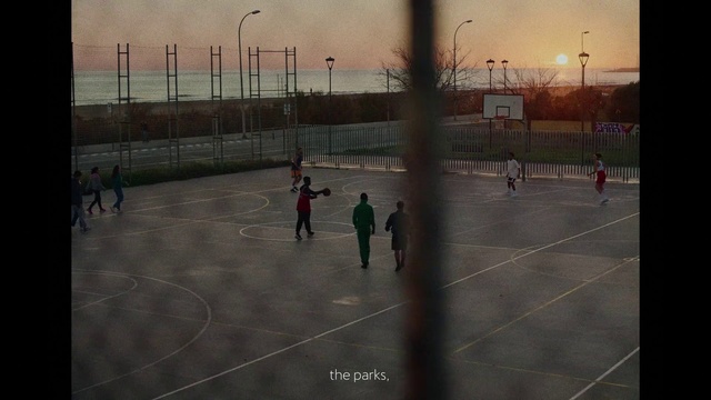 Video Reference: Sky, Building, Sports equipment, Field house, Football, Ball, Tree, Plant, Basketball court, Player