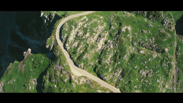 Video Reference: Natural landscape, Terrestrial plant, Slope, Terrain, Urban design, Grass, Landscape, Air travel, Grassland, Road