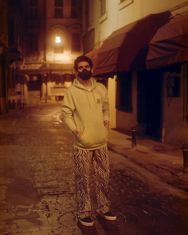 Video Reference: Window, Road surface, Temple, Standing, Street light, Flash photography, Flooring, Public space, Street fashion, Morning