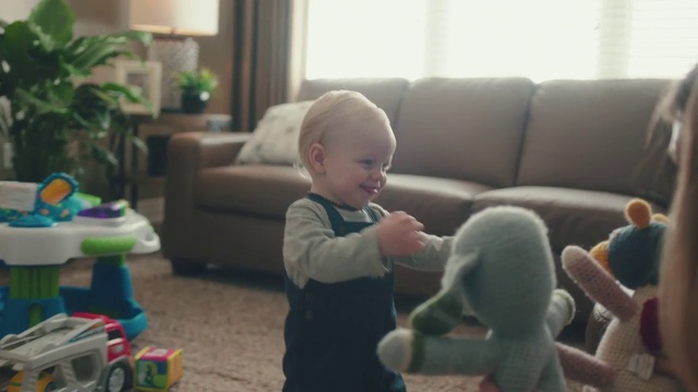 Video Reference: Skin, Furniture, Smile, Couch, Comfort, Window, Plant, Living room, Baby, Houseplant