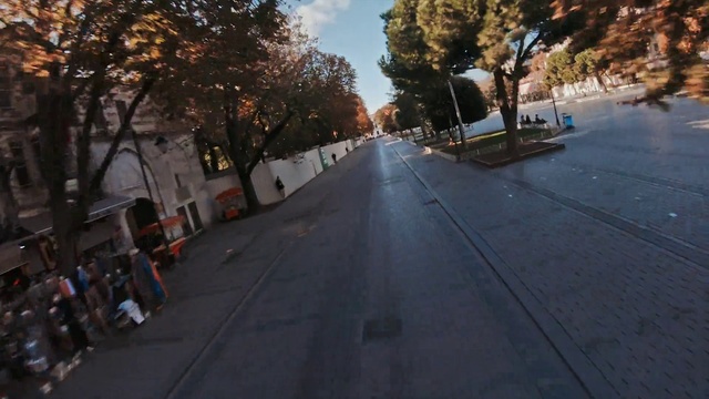 Video Reference: Sky, Plant, Cloud, Road surface, Tree, Asphalt, Branch, Neighbourhood, Thoroughfare, Residential area