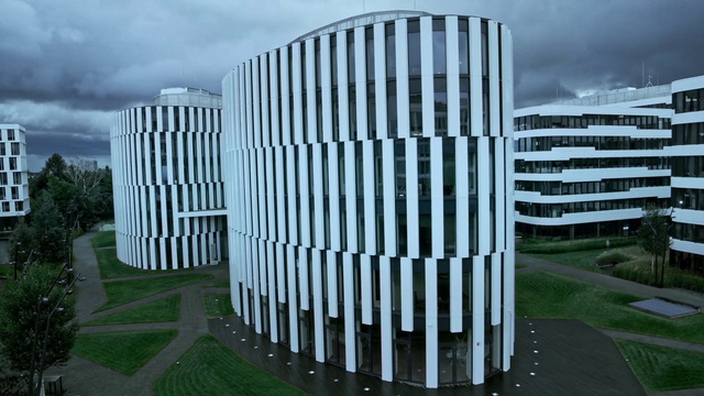 Video Reference: Sky, Cloud, Plant, Building, Urban design, Grass, Land lot, Tree, Tower block, Condominium