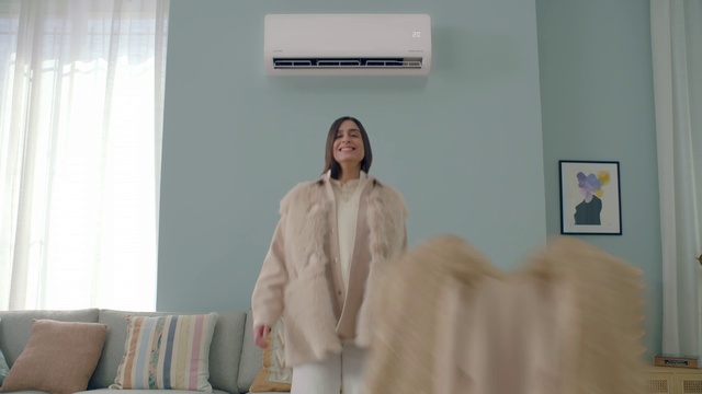 Video Reference: Smile, Sleeve, Comfort, Curtain, Fashion design, Event, Room, Picture frame, Fur, Couch