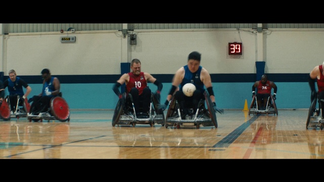 Video Reference: Wheelchair, Wheelchair sports, Sports equipment, Field house, Disabled sports, Sports uniform, Wheel, Ball, Player, Wheelchair basketball