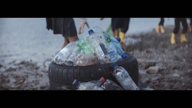 Video Reference: Water bottle, Flash photography, Plastic bottle, Automotive tire, Grass, Plastic bag, Adaptation, Human leg, Personal protective equipment, Drink