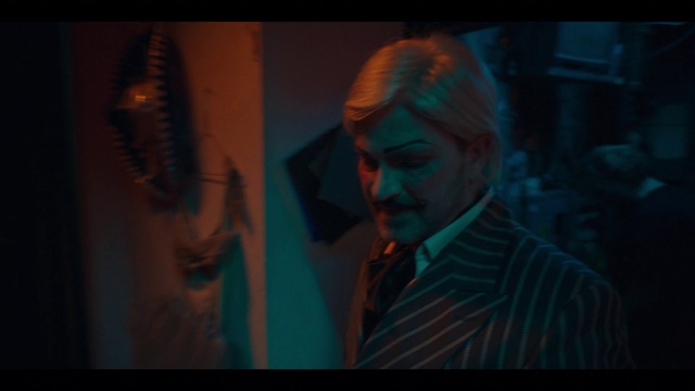 Video Reference: Jaw, Flash photography, Art, Suit, Font, Space, Electric blue, Event, Display device, Visual arts