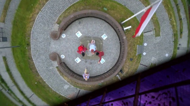 Video Reference: Automotive tire, Circle, Symmetry, Automotive wheel system, Rim, Art, Grass, Urban design, Pattern, Concrete