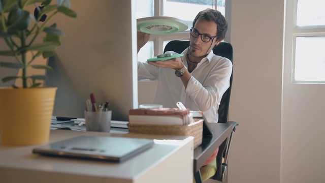Video Reference: Glasses, Plant, Table, Window, Vision care, Sleeve, Interior design, Wood, Eyewear, Desk