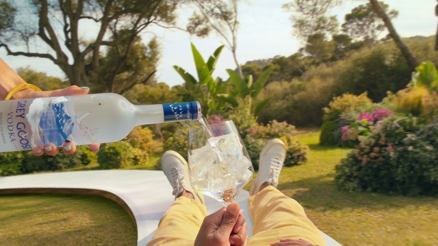 Video Reference: Plant, Bottle, Sky, Tree, Water bottle, Gesture, Sunlight, Yellow, Plastic bottle, Grass