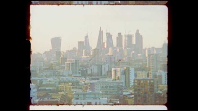 Video Reference: Building, Skyscraper, Sky, World, Rectangle, Tower block, Urban design, Font, Tower, Tints and shades