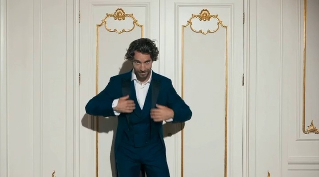 Video Reference: Dress shirt, Sleeve, Gesture, Happy, Door, Blazer, Formal wear, Event, Street fashion, Beard