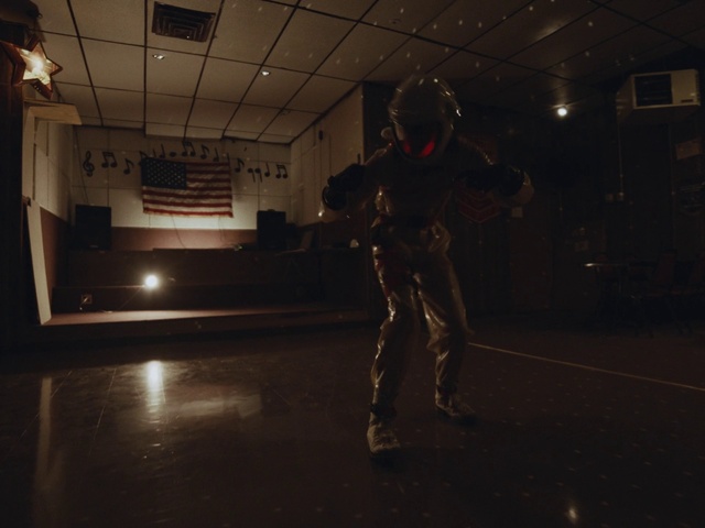 Video Reference: Flash photography, Floor, Flooring, Helmet, Military person, Entertainment, Darkness, Event, Art, Boot