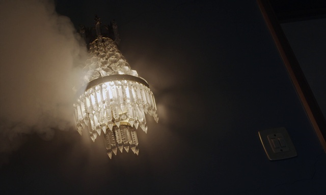 Video Reference: Automotive lighting, Chandelier, Tints and shades, Font, Ceiling, Ceiling fixture, Glass, Metal, Cloud, Event