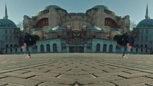 Video Reference: Sky, Road surface, Building, Travel, City, Facade, Leisure, Cobblestone, Symmetry, Flooring