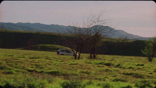 Video Reference: Sky, Plant, Wheel, Mountain, Tire, Vehicle, Car, Natural landscape, Tree, Slope