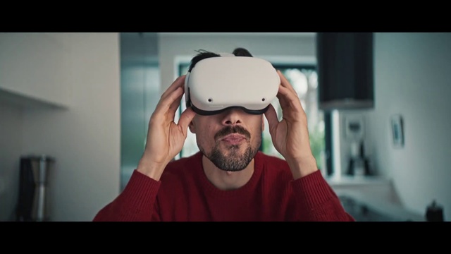 Video Reference: Mouth, Jaw, Neck, Sleeve, Beard, Flash photography, Gesture, Audio equipment, T-shirt, Facial hair