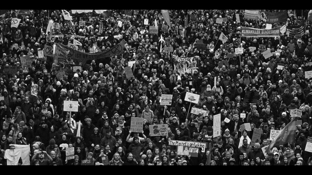 Video Reference: Black-and-white, Style, Font, Fan, Urban design, Crowd, City, Event, Monochrome, Monochrome photography