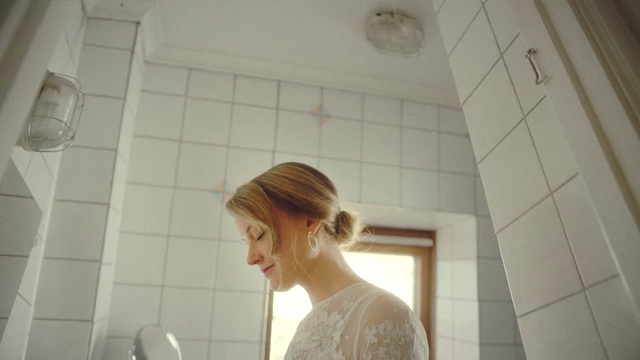 Video Reference: Bun, Eyelash, Black hair, Plumbing fixture, Flash photography, Plumbing, Ceiling, Happy, Fashion design, Flooring