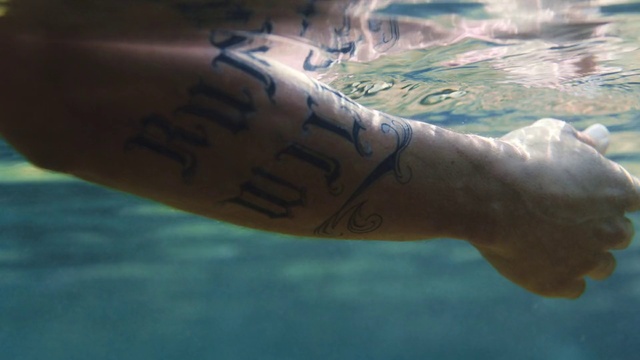 Video Reference: Cloud, Arm, Leg, Human body, Handwriting, Temporary tattoo, Gesture, Finger, Tattoo, Elbow