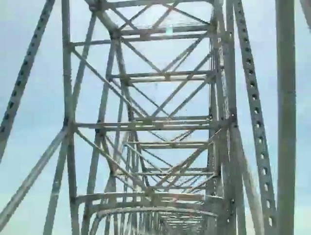 Video Reference: Sky, Electricity, Overhead power line, Symmetry, Engineering, Cloud, Triangle, Public utility, Girder bridge, Electrical supply