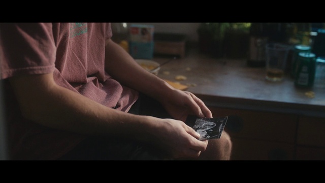 Video Reference: Flash photography, Gesture, Elbow, Thumb, Wrist, Nail, Human leg, Darkness, Knee, Font