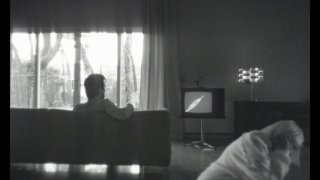 Video Reference: Furniture, Couch, Comfort, Black, Window, Curtain, Interior design, Black-and-white, Building, Grey