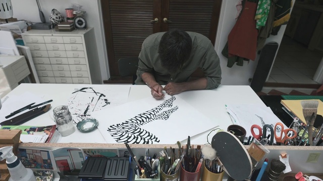 Video Reference: Automotive design, Eyewear, Table, Art, Engineering, Desk, Font, T-shirt, Artist, Event