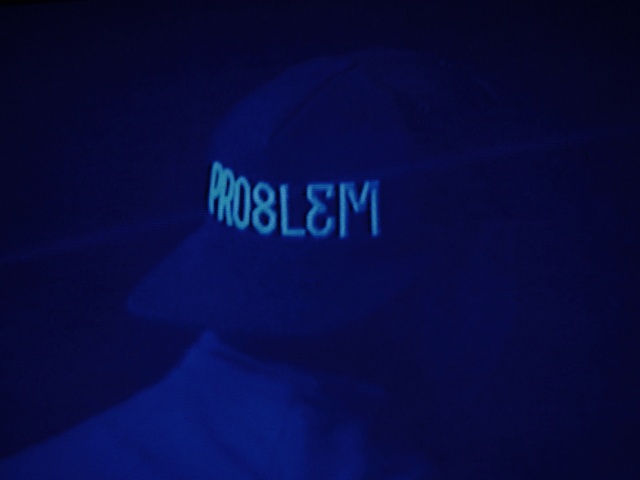 Video Reference: Cap, Cricket cap, Blue, Hat, Sleeve, Baseball cap, Headgear, Font, T-shirt, Electric blue