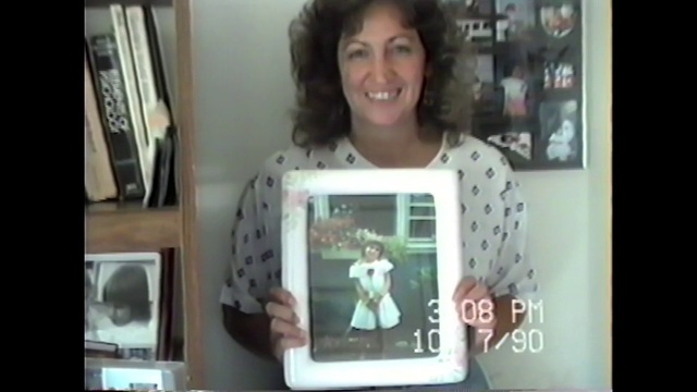 Video Reference: Smile, Picture frame, Sleeve, Shelf, Gadget, People, T-shirt, Display device, Fun, Electronic device