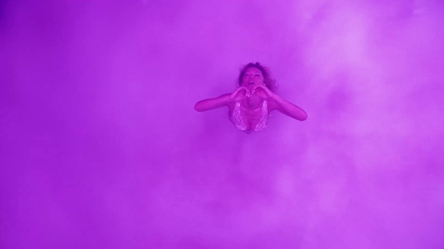 Video Reference: Purple, Violet, Pink, Magenta, Art, Electric blue, Entertainment, Symmetry, Event, Pattern
