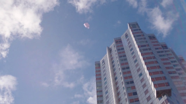 Video Reference: Cloud, Sky, Building, Skyscraper, Atmosphere, Tree, Window, Tower block, Balloon, Atmospheric phenomenon