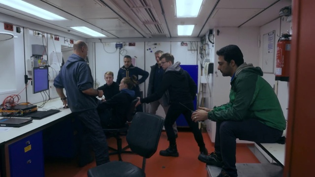 Video Reference: Computer monitor, Chair, Jacket, Engineering, Computer keyboard, Service, Event, Desk, White-collar worker, Suit