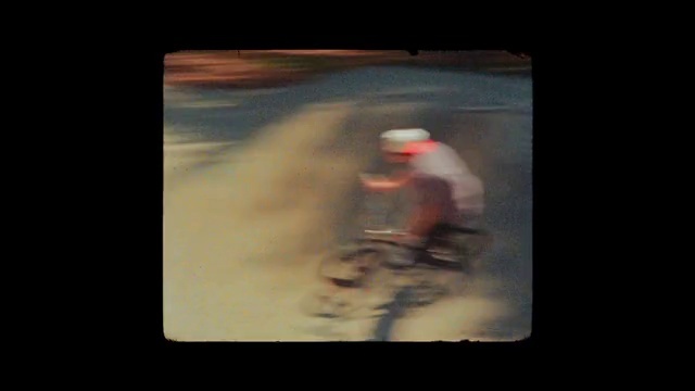 Video Reference: Bicycle, Sports equipment, Sky, Cloud, Tints and shades, Font, Automotive lighting, Recreation, Art, Asphalt