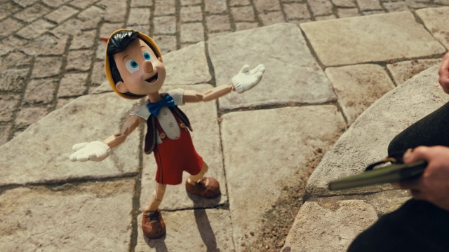 Video Reference: Toy, Doll, Wood, Road surface, Leisure, Recreation, Fun, Helmet, Sidewalk, Asphalt