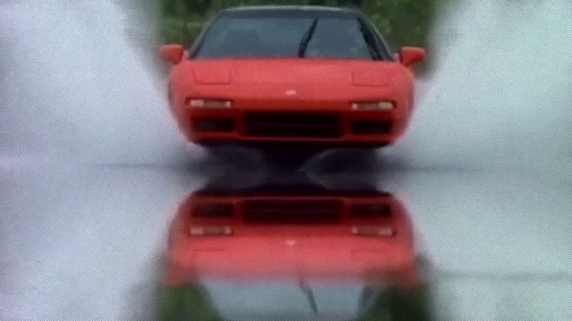 Video Reference: Vehicle, Hood, Automotive lighting, Toy, Car, Red, Automotive design, Motor vehicle, Bumper, Automotive mirror