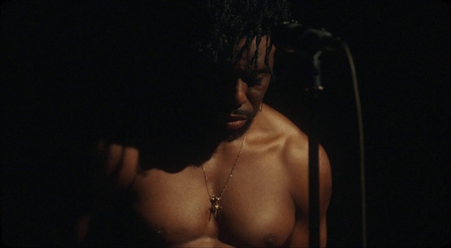 Video Reference: Microphone, Flash photography, Brassiere, Lingerie top, Chest, Barechested, Trunk, Abdomen, Event, Audio equipment