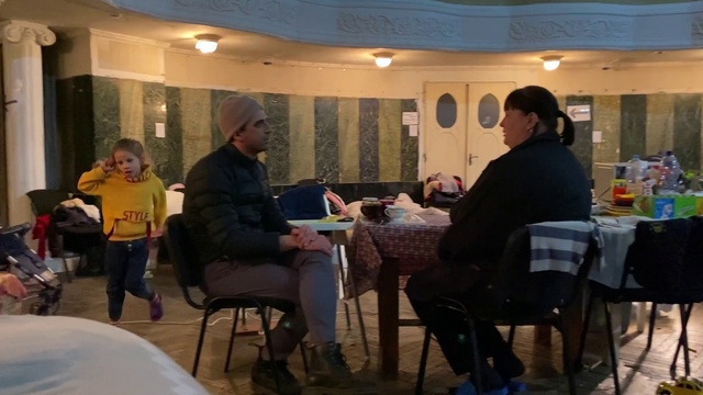 Video Reference: Shoe, Furniture, Chair, Coat, Table, Sharing, Leisure, Event, Conversation, Recreation