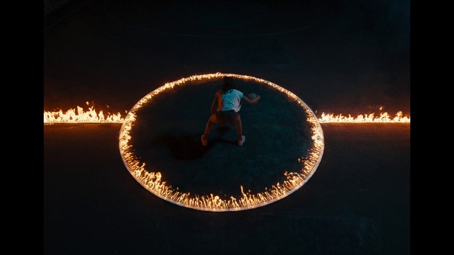 Video Reference: Organism, People in nature, Heat, Circle, Font, Entertainment, Event, Symmetry, Darkness, Electric blue