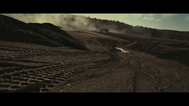 Video Reference: Cloud, Atmosphere, Ecoregion, Sky, Natural landscape, Grass, Black-and-white, Slope, Road surface, Asphalt