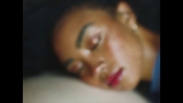 Video Reference: Nose, Cheek, Lip, Eyebrow, Eyelash, Jaw, Ear, Gesture, Flash photography, Darkness